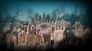 Image of people in union raising their hands.